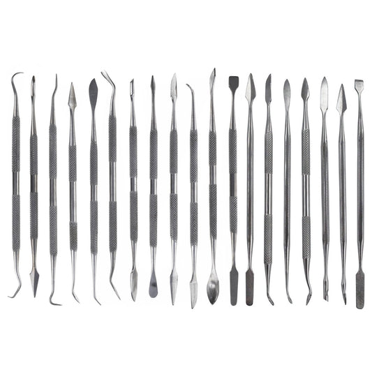 Nineteen dual-sided stainless steel picks and spatulas with various tips arranged in a set