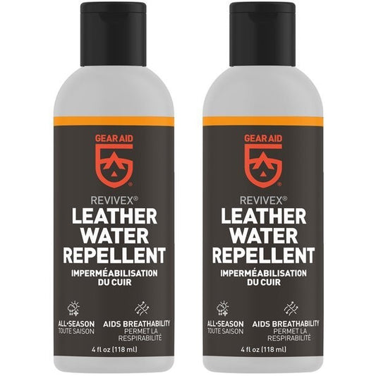 Two bottles of Gear Aid Revivex leather footwear water repellent, 4 oz. each, upright.