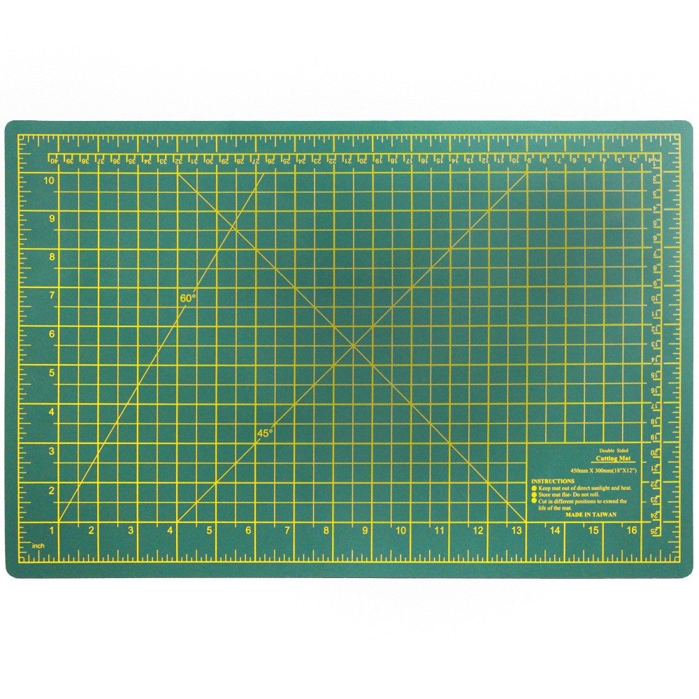 Green double-sided self-healing cutting mat, 18 by 12 inches, with grid lines