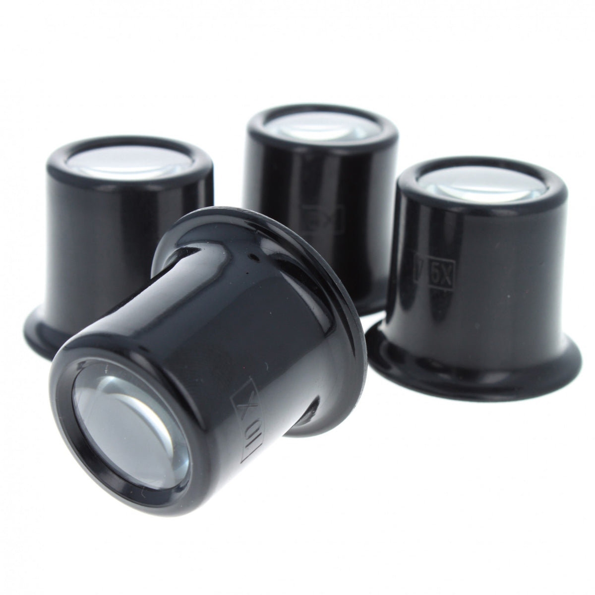 Set of four plastic jewelers eye loupes with various magnification strengths