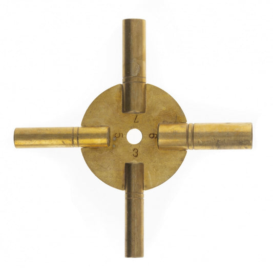 Antique style brass clock key with four prongs, designed for grandfather clocks with odd number fittings.