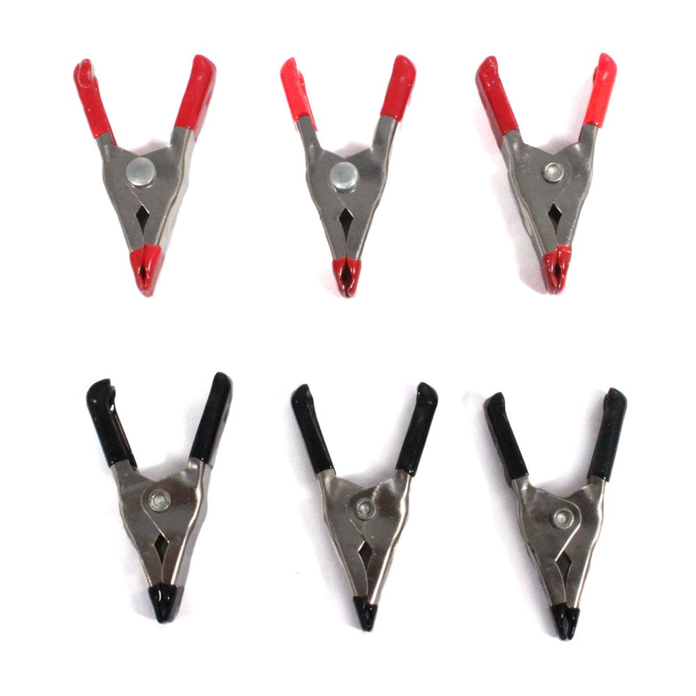 Set of six metal spring clamps with rubber grips for heavy-duty workshop use