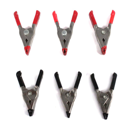 Set of six metal spring clamps with rubber grips for heavy-duty workshop use