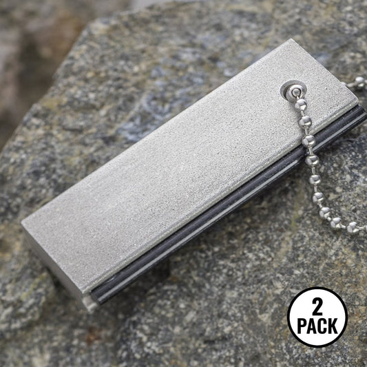 Two magnesium pocket flint fire starters with grip handles for camping or emergency kits