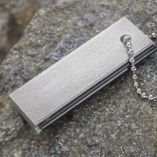 Magnesium pocket flint fire starter with grip handle for camping and survival use